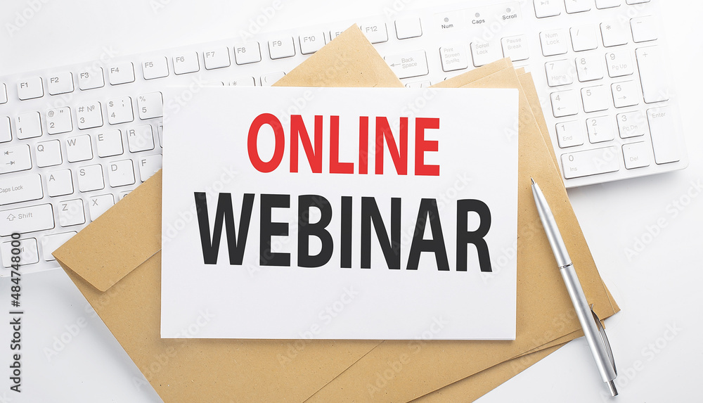 Poster text online webinar on the envelope on the keyboard