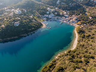 Agios Stefanos bay, one of the most beautiful fishing villages in Corfu Island. Kerkyra, Greece. Aerial drone  view.