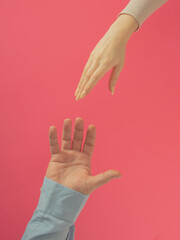 Love with man and women hand against pink background. creative valentines adorable decoration idea