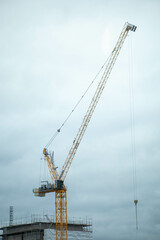 Fototapeta na wymiar Crane for Construction Site within the City