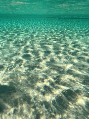 Fototapeta na wymiar Underwater split photo of paradise exotic island beach with crystal clear turquoise sea in exotic destination island