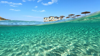 Underwater split photo of paradise beach of Simos in island of Elafonisos, Lakonia, Greece