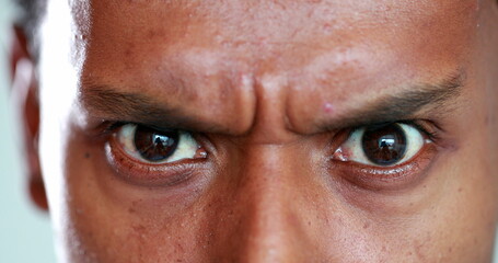 Man has a serious look on his face. Closeup of man frowning and with an angry face, unbelief reaction