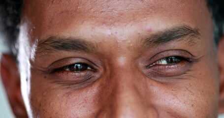 Happy person smiling to camera, close-up eyes feeling joy, macro closeup