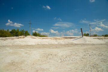 outskirts waste land polluted area after industrial human activity, dirty pipes, abandoned factory...
