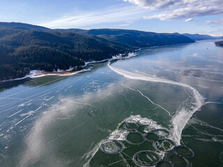 Aerial winter view of Dospat Reservoir covered with ice, Bulgaria