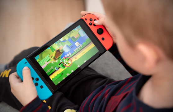 Boy plays Nintendo Switch console Stock Photo Adobe Stock