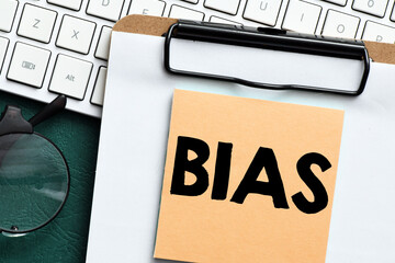 BIAS word on a small sheet of paper.