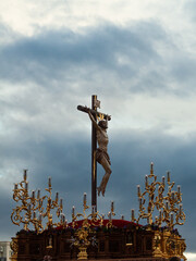 Naklejka premium sculpture of jesus christ crucified in the easter procession in granada,sevilla,andalucia,spain. holy week in sevilla and granada. Vertical photography with copy space