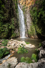 Fototapeta na wymiar Beautiful view to big wild green cerrado waterfall landscape