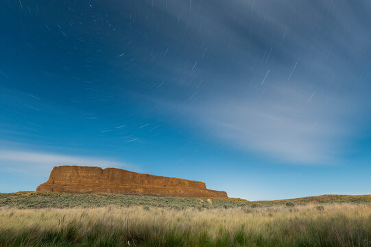 Star trails swirl over Steamboat Rock in Eastern Washington
