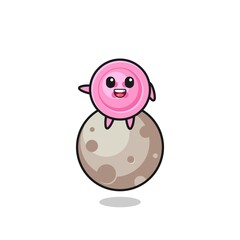 illustration of clothing button cartoon sitting on the moon