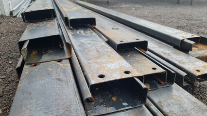 Metal profile. Rectangle steel rail Set up a pile in a steel warehouse.