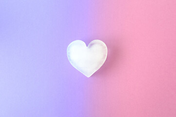 Icy heart on a combination of purple and pink background colors. Valentines ice love aesthetic...