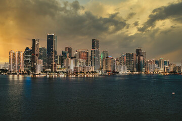 Naklejka premium city skyline at sunset beautiful miami buildings sea sky skyscrapers luxury business urban Brickell downtown florida usa 