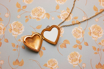 Gold Heart Reliquary over a Floral Vintage Background