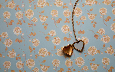 Gold Heart Reliquary over a Vintage Floral Background