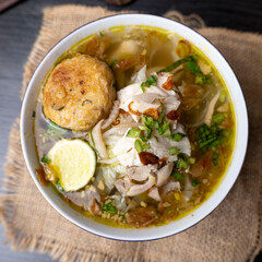 Soto Ayam is a traditional Indonesian soup mainly composed of broth, chicken and vegetables
