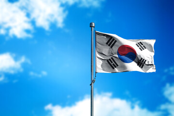 Flag of South Korea on the wind against blue sky