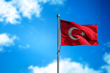 Flag of Turkey on the wind against blue sky