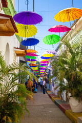 street decorated with umbrellas in cartagena de indias, getsemani