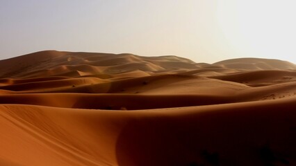 Fototapeta na wymiar Orange Waves of the Sand Sea, Sahara Desert, Morocco