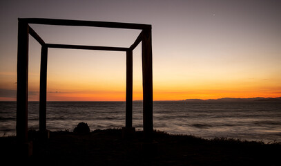 Fototapeta premium Sunset on the beach, shadows, copy space, blur, stars, starry night, blue, red, orange, mindfulness, meditation, landscape, peace, solitude, reflect, meditate, meditate, being alone thinking, freedom,