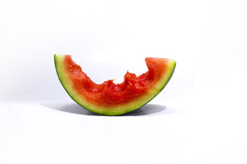 Close-up view of eaten watermelon slices isolated on a white background. Tropical fruits, healthy eating, and summer background concept.