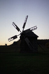 Fototapeta na wymiar old windmill at sunset