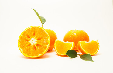 Group of oranges and leaves. Fresh-looking yellow fruit isolated on a white background. Fruits with vitamins and good health focus on specific points. Advertising concept and healthy, space for text