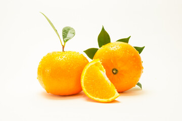 Group of oranges and leaves. Fresh-looking yellow fruit isolated on a white background. Fruits with vitamins and good health focus on specific points. Advertising concept and healthy, space for text