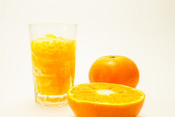  sliced orange fruit. Fresh-looking yellow fruit on a white background. Less sweet fruit juices. Fruits with vitamins and good health. Focus on specific points.  concept and healthy, space for text