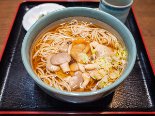 mushroom japanese soba noodle in the soup ball in the restaurant