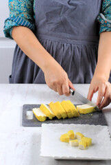 Female Hand Slice Cut Yellow Tofu