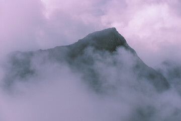 mountain peak in fog