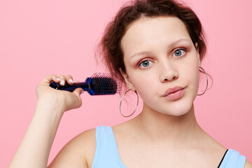 beautiful woman removes hair on a comb dissatisfaction isolated background unaltered