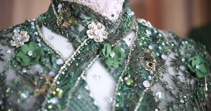 The wedding dress is decorated with sequins. A special elegant dress for the bride decorated with flowers