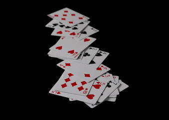 Playing cards for poker and gambling, isolated on black  
