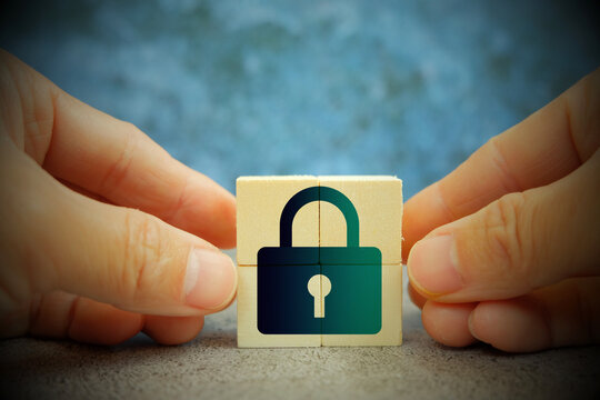 Hand touching padlock protects business and information data network connections, smart solution from digital attack developed by innovation technology, cyber security