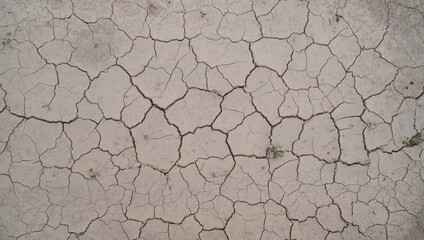 Cracked dry mud background  in summer on the top view
