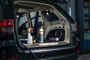 Clean open empty car trunk in the car detailing service - obrazy, fototapety, plakaty
