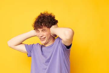 red-haired curly guy in a purple t-shirt gesture hands emotions