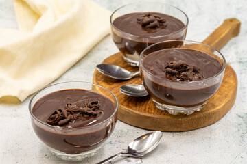 Supangle dessert on gray background. A chocolate pudding with a semi-solid, semi-liquid consistency.