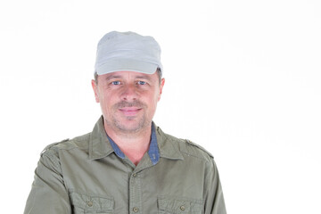 Middle-aged military cap man handsome posing in front of a white background with copy space