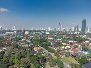 Naklejka premium Aerial shot of the Manila skyline skyscraper clusters as seen from Corinthian Gardens. 