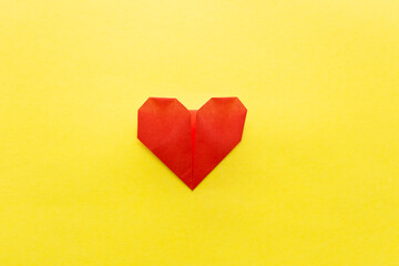 Naklejka na ściany i meble Step by step instructions how to make origami easy heart.