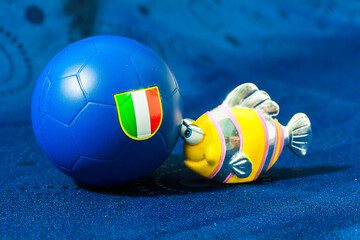 Fish toy with Italian soccer ball