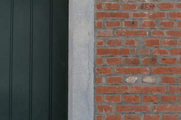 Fragment of a wooden door, doorway, brick wall. copy space