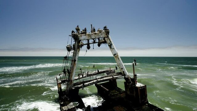 Derelict shipwreck (fishing trawler) on Namibia coastline, Atlantic; aerial