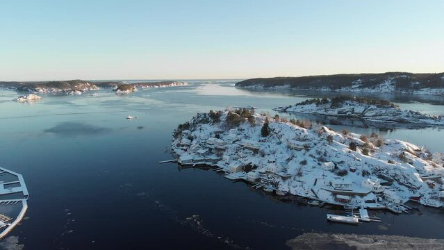 Aerial View Of Fjord And Kragero Norwegian City Covered In Snow - drone shot